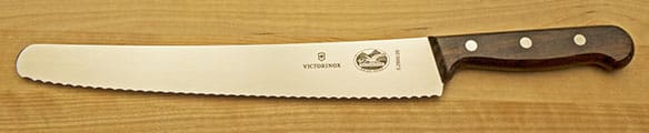 A close up of the victorinox knife on top of a table.