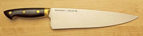 A white knife with the name kramer 2 on it.