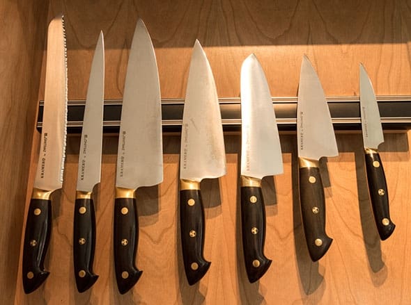 A row of knives on the wall